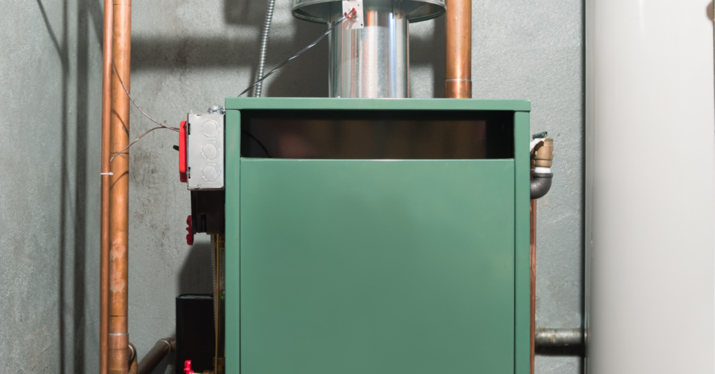 Green oil furnace in a basement