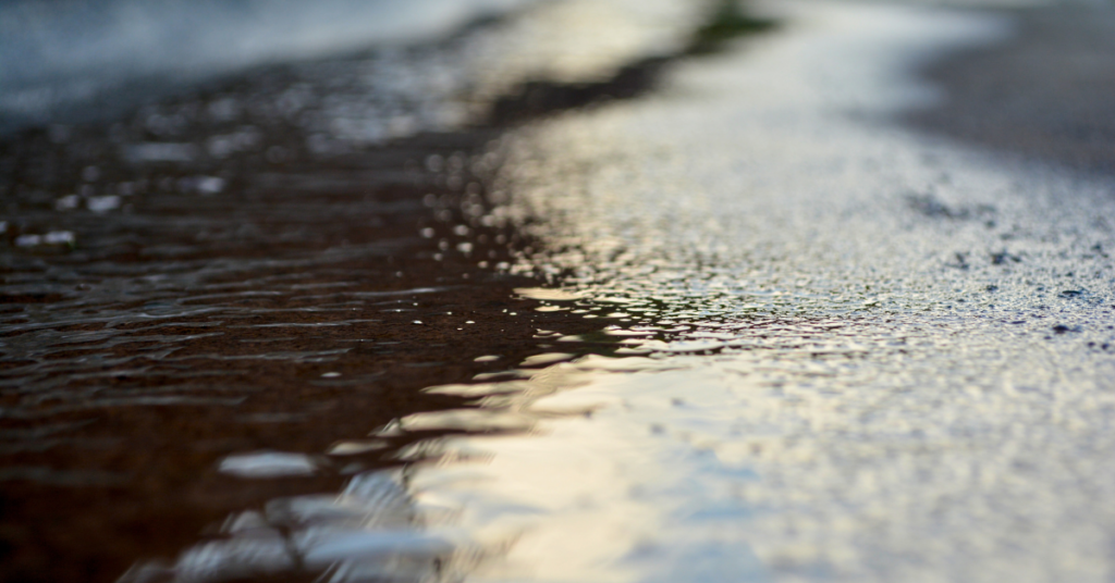 stormwater on asphalt road that needs stormwater management