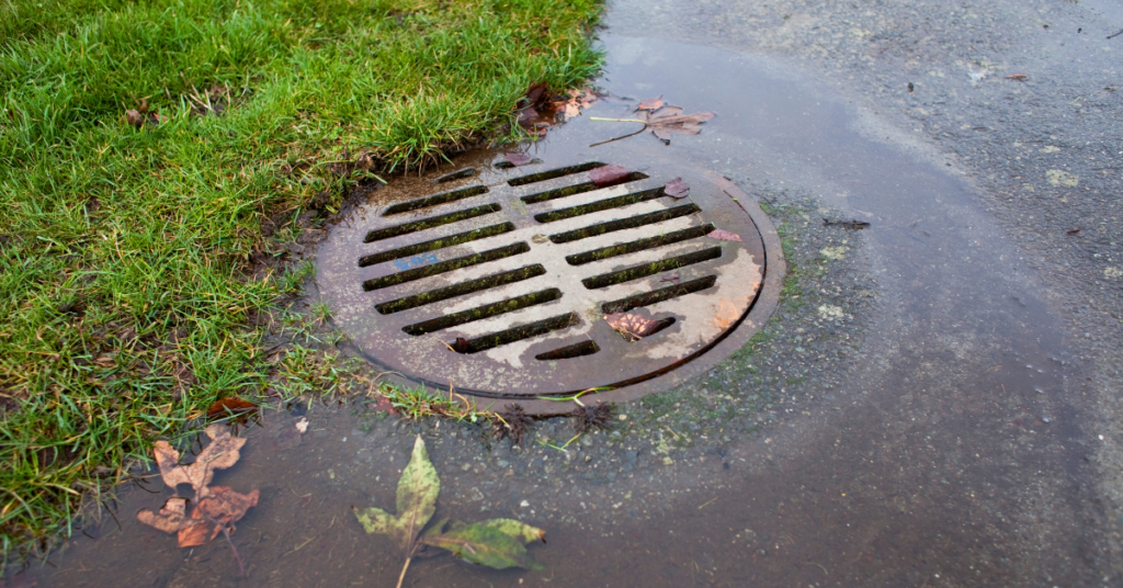 Stormwater drain being slowly filled by rain water
